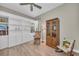 A comfortable reading area with a built-in bookcase and wood-look flooring at 5529 Mulligan Way, Bradenton, FL 34211