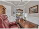Comfortable office featuring a ceiling fan, natural light, and an ornate writing desk at 5529 Mulligan Way, Bradenton, FL 34211
