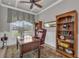Comfortable office featuring a ceiling fan, natural light, and a built-in bookcase at 5529 Mulligan Way, Bradenton, FL 34211