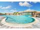 Resort-style pool with waterfall feature and comfortable lounge area at 5529 Mulligan Way, Bradenton, FL 34211