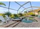 Screened pool and spa surrounded by lush greenery and comfortable seating at 5529 Mulligan Way, Bradenton, FL 34211