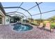 Inviting screened pool with scenic views of the golf course and lounge chairs at 5529 Mulligan Way, Bradenton, FL 34211