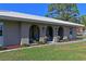 Inviting home entrance with arched openings, cozy seating, and manicured landscaping enhancing its curb appeal at 603 Verrocchio Dr # 603, Nokomis, FL 34275