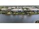 Aerial view of lakeside condos with mature trees and serene water views at 6326 Grand Oak Cir # 101, Bradenton, FL 34203