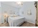 Well-lit bedroom featuring a ceiling fan, carpet flooring, and charming coastal decor at 6326 Grand Oak Cir # 101, Bradenton, FL 34203