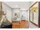 Condo foyer with hardwood floors, elegant furnishings, and decorative artwork, creating a stylish entry space at 6326 Grand Oak Cir # 101, Bradenton, FL 34203