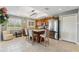 Bright kitchen featuring an island with seating, stainless steel appliances, and wood cabinets at 6326 Grand Oak Cir # 101, Bradenton, FL 34203