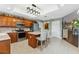 Bright kitchen featuring an island with seating, stainless steel appliances, and dark wood cabinets at 6326 Grand Oak Cir # 101, Bradenton, FL 34203