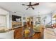 Bright living room featuring hardwood floors, stylish decor, a ceiling fan and an open floor plan at 6326 Grand Oak Cir # 101, Bradenton, FL 34203