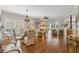 Spacious living room with wood floors, elegant furnishings, and natural light creating a comfortable and stylish space at 6326 Grand Oak Cir # 101, Bradenton, FL 34203