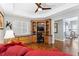 Cozy room with a ceiling fan, beautiful wood floors and built-in shelves at 6326 Grand Oak Cir # 101, Bradenton, FL 34203