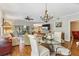 Open living space with dining area, comfortable seating, hardwood floors, and seamless access to outdoor patio at 6326 Grand Oak Cir # 101, Bradenton, FL 34203