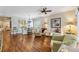 Open living space with dining and living areas, comfortable seating, hardwood floors, and stylish decor at 6326 Grand Oak Cir # 101, Bradenton, FL 34203