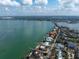 Waterfront property aerial view showcasing homes with private docks along a scenic coastline at 679 Norsota Way, Sarasota, FL 34242