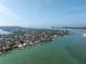 Waterfront homes with docks lining a pristine bay, shown in this aerial shot at 679 Norsota Way, Sarasota, FL 34242