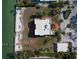 Aerial view of waterfront home and property including seawall and dock at 679 Norsota Way, Sarasota, FL 34242
