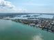 Aerial shot showcases waterfront homes, boat docks, and tranquil bay views at 679 Norsota Way, Sarasota, FL 34242