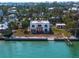 Two story waterfront property on a large lot with private dock and bay access at 679 Norsota Way, Sarasota, FL 34242