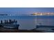 Stunning night view of a bridge and city skyline reflected in the calm waters at 679 Norsota Way, Sarasota, FL 34242