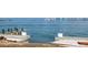 Gorgeous waterfront view with boat dock and city skyline at 679 Norsota Way, Sarasota, FL 34242