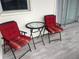 Cozy patio with chairs and a table at 7211 W Country Club N Dr # 135, Sarasota, FL 34243