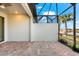 A screened-in lanai with brick flooring offers a relaxing outdoor living space at 7629 Summerland Cv, Bradenton, FL 34202