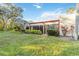 Backyard featuring lush green grass, garden beds, and a tranquil atmosphere at 805 Spring Lakes Blvd # 805, Bradenton, FL 34210