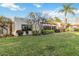 Well-maintained backyard with lush lawn, trimmed shrubs, and natural light at 805 Spring Lakes Blvd # 805, Bradenton, FL 34210