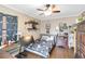 Cozy bedroom features modern decor, wood floors, a ceiling fan and ample storage space at 805 Spring Lakes Blvd # 805, Bradenton, FL 34210