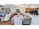 Open-concept dining area with a stylish chandelier, decorative accents, and hardwood floors at 805 Spring Lakes Blvd # 805, Bradenton, FL 34210