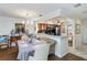 Dining room with hardwood flooring, modern lighting, and an open view to the kitchen at 805 Spring Lakes Blvd # 805, Bradenton, FL 34210