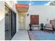 Welcoming condo entrance with a cozy patio, decorative shutters, and ample natural light at 805 Spring Lakes Blvd # 805, Bradenton, FL 34210