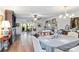 Spacious living room featuring hardwood floors, a dining area, and abundant natural light at 805 Spring Lakes Blvd # 805, Bradenton, FL 34210