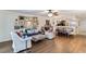 Open-concept living room with dining area and a view into the kitchen at 805 Spring Lakes Blvd # 805, Bradenton, FL 34210