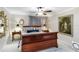 Serene main bedroom with a ceiling fan, plush carpeting, and elegant decor at 805 Spring Lakes Blvd # 805, Bradenton, FL 34210