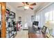 Bright office with built-in shelving, a ceiling fan, and a large desk for a comfortable workspace at 805 Spring Lakes Blvd # 805, Bradenton, FL 34210