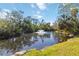Picturesque pond featuring a fountain, lush surroundings, and serene ambiance for relaxing walks and peaceful views at 805 Spring Lakes Blvd # 805, Bradenton, FL 34210