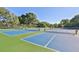 A well-maintained tennis court on a sunny day, perfect for outdoor recreation and active lifestyles at 805 Spring Lakes Blvd # 805, Bradenton, FL 34210