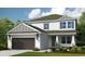 Charming two-story home features a two car garage and manicured lawn at 8513 Golden Dawn Ct, Sarasota, FL 34241