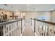 Second floor hallway with wood and metal railing at 8513 Golden Dawn Ct, Sarasota, FL 34241