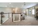 Bright upstairs hallway boasts neutral colors, plush carpet, and easy access to all rooms at 8513 Golden Dawn Ct, Sarasota, FL 34241