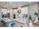 Modern kitchen featuring a large center island and stainless appliances at 8513 Golden Dawn Ct, Sarasota, FL 34241