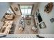 Aerial view of open-concept living area with elegant furniture, decor, and large windows at 8513 Golden Dawn Ct, Sarasota, FL 34241