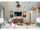 Inviting living room with soaring ceilings, stylish decor, and neutral color palette at 8513 Golden Dawn Ct, Sarasota, FL 34241