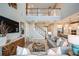Bright living room with staircase, high ceilings, and comfortable furniture at 8513 Golden Dawn Ct, Sarasota, FL 34241