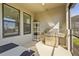 Outdoor kitchen on the covered patio with large windows at 8609 Evening Dr, Sarasota, FL 34241