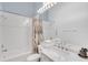 Well-lit bathroom with tub, shower, and a vanity with sink at 8717 54Th E Ave, Bradenton, FL 34211