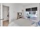 Bright bedroom featuring a sliding glass door to the backyard pool, providing ample natural light at 8717 54Th E Ave, Bradenton, FL 34211