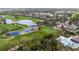 Panoramic aerial view of a pristine golf course with serene lakes and lush fairways at 8717 54Th E Ave, Bradenton, FL 34211