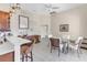 Bright kitchen with a breakfast bar and adjacent dining area with natural light at 8717 54Th E Ave, Bradenton, FL 34211
